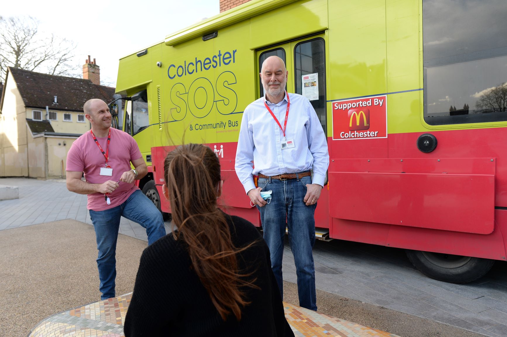 Volunteers outside the Open Road SOS and community bus